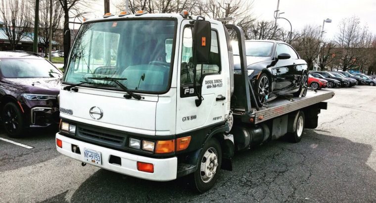 Towing flatbed tow truck and scrap car removal