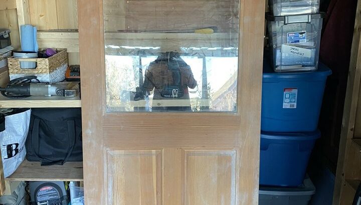 Beautiful new wood door with beautiful wood grain/thick window