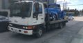 Towing flatbed tow truck and scrap car removal
