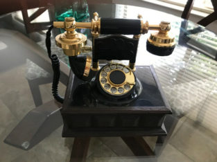 Old rotary dial cradle phone