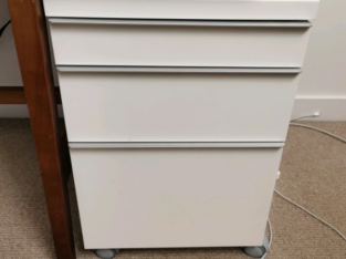 A 57cm tall white IKEA drawer with wheels