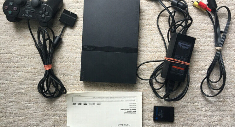 PlayStation 2 slim console with 6 games