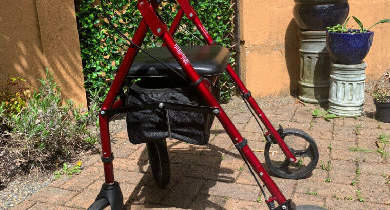 Used Hugo walker with seat and storage in excellent condition!