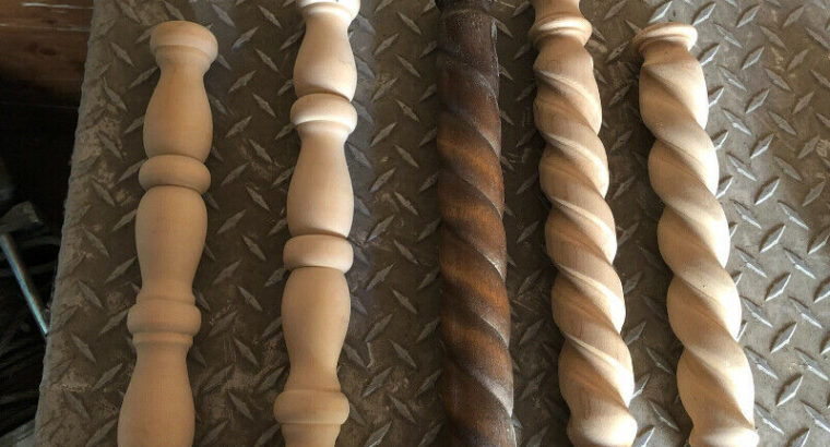 Ornamental wooden spindles with wooden screws and wooden tops.