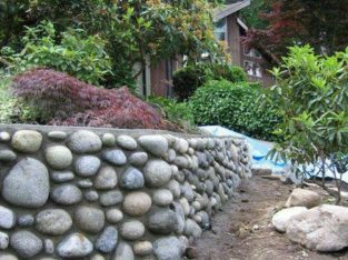 Rock wall and concrete repairs softscaping topsoil bark mulch