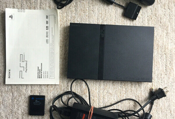 Playstation 2 slim console with 6 games