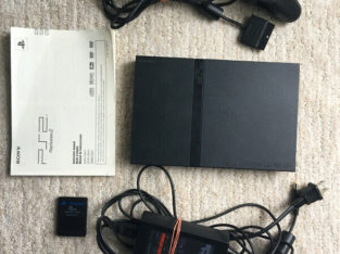 Playstation 2 slim console with 6 games