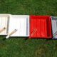 4 darkroom coloured, chemical trays with tongs
